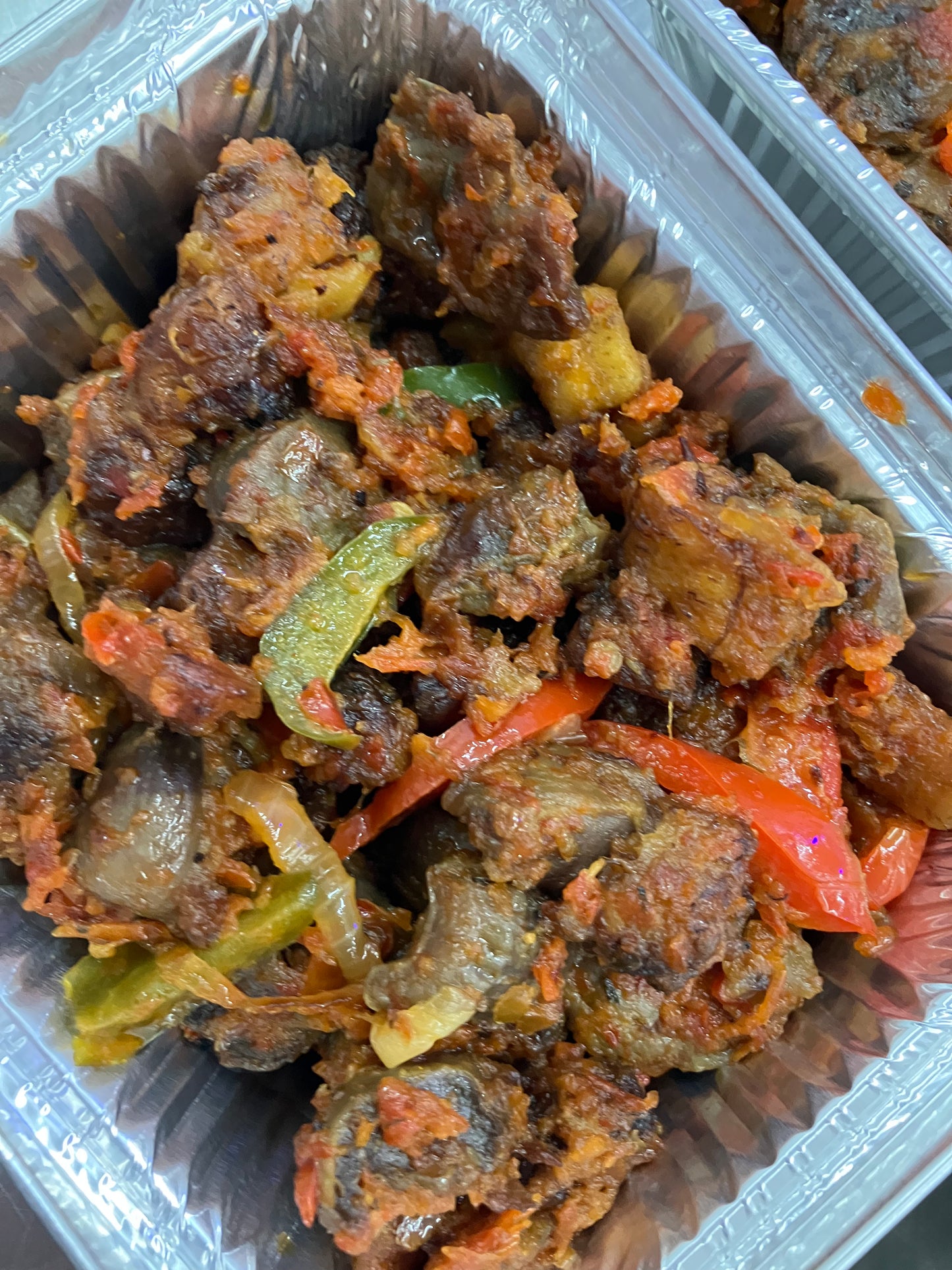 Chicken gizzard stewed with fried plaintain